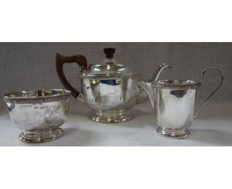 A THREE PIECE SILVER TEA SERVICE, comprising teapot, milk jug and sugar bowl