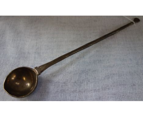 A PRIMITIVE HAMMERED BRONZE LADLE, 32cm long