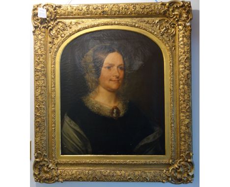 ATTRIBUTED TO LEONARD POYET (1798-1873): A bust length portrait of a woman wearing a lace bonnet and collar with cameo brooch