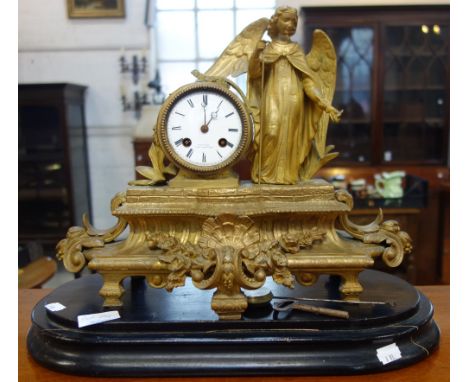 A 19TH CENTURY FRENCH GILT SPELTER MANTEL CLOCK decorated with a study of an angel, the white enamel face inscribed, 'LAGACHE