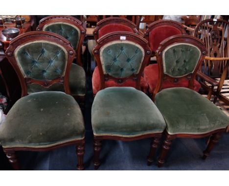 A SET OF SIX VICTORIAN MAHOGANY DINING CHAIRS with moulded and carved decoration, four upholstered in green button velvet, tw