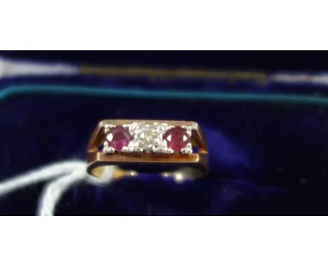 A DIAMOND AND "RUBY" RING, on an 18ct yellow gold shank, ring size K