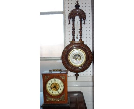 AN EDWARDIAN WALNUT CASED MANTEL CLOCK, with gilt metal mounts and an Edwardian aneroid barometer