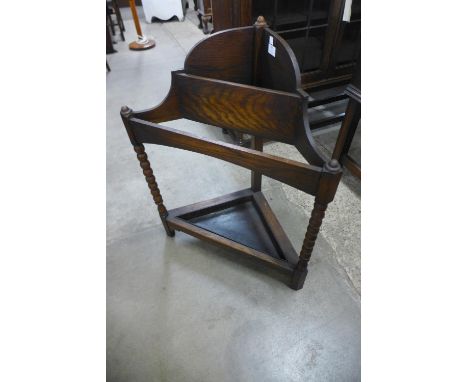 An oak corner stick stand 
