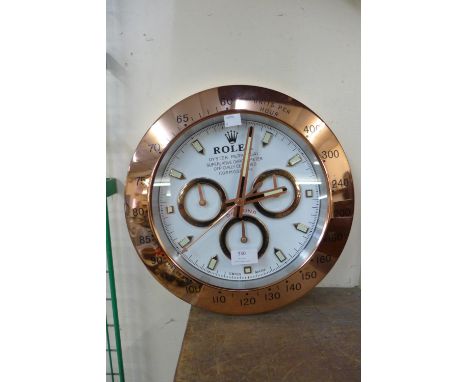 A Rolex style circular wall clock 
