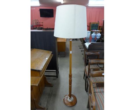 A teak standard lamp 