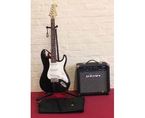 Cruiser by Crafter black and white electric guitar with amplifier and stand. Condition report: see terms and conditions