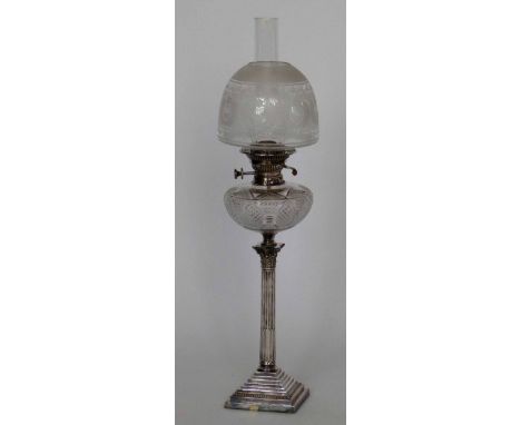 Electro plated Corinthian column table oil lamp with a cut glass reservoir and etched glass shade, height to burner 53cm. Con