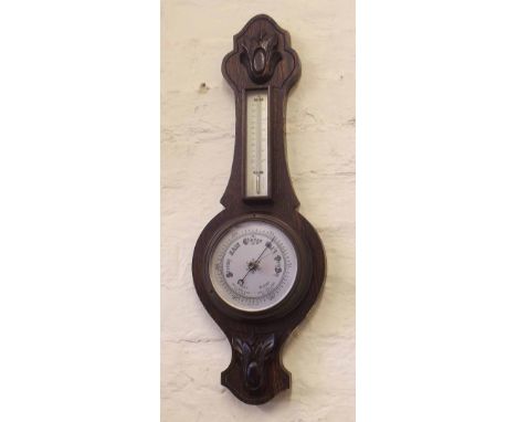 Edwardian oak aneroid barometer. Condition report: see terms and conditions