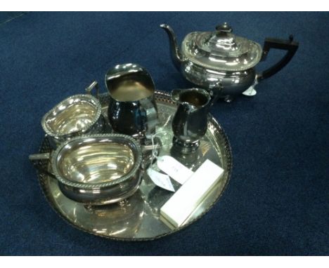 SILVER PLATED THREE PIECE TEA SERVICE along with a cake basket, tray and cased cutlery