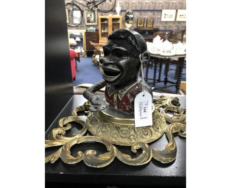 'JOLLY MAN' CAST IRON MONEY BANK along with a wheel barometer