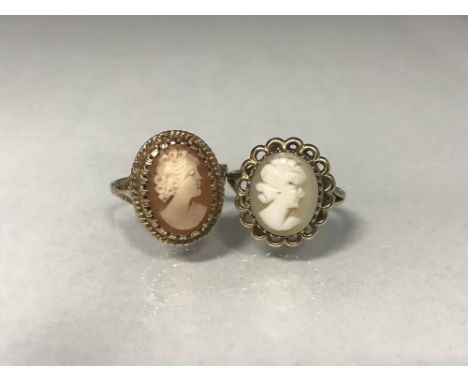 TWO CAMEO RINGS both depicting a female in profile facing right, one within a scalloped border, both in nine carat gold, 6g g