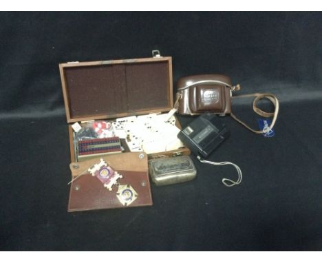 GROUP OF MEDALS contained in a leather case, along with a games compendium, a vintage Ilford camera, a Kodak tele disk camera