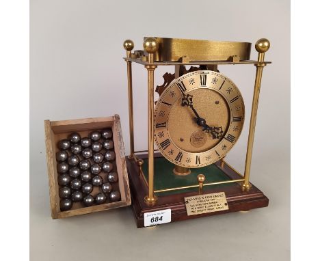 A Thwaites &amp; Reed spheroid weight clock, no.780/1000