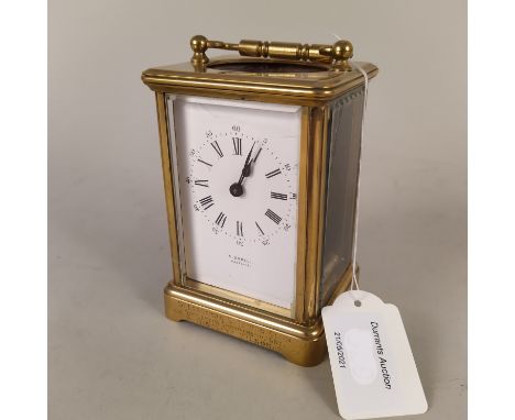 A late 19th Century brass carriage clock by E.Dobell, Hasting, inscription to case