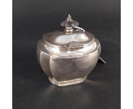 A silver tea caddy with wooden finial, hallmarked London 1910, maker's mark GH (possibly George Heath), (two dents noted and 