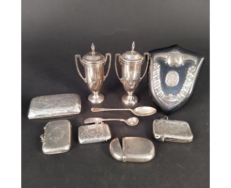 A quantity of silver items including vestas, a lighter, a small cigarette case, two miniature trophy cups with inscriptions e