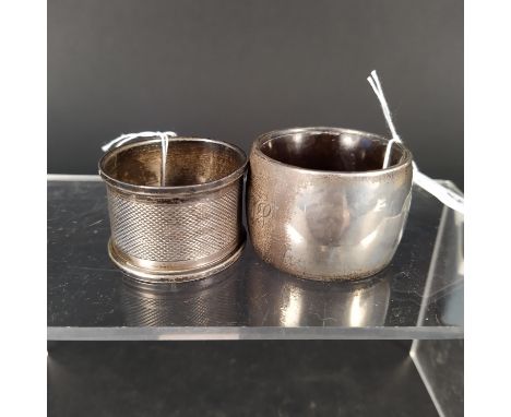 Two silver napkin rings, one with filled inner, the other with engine turned decoration