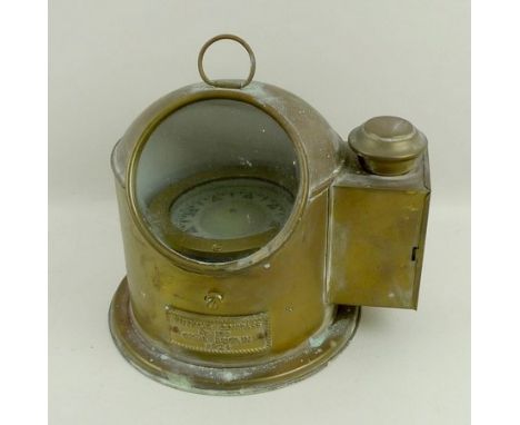A brass lifeboat compass in a copper and brass binnacle, bears cast plate 'Lifeboat Compass, Nr. 879, Great Britain, 1924', 2