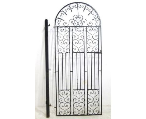 A wrought iron garden gate, painted black, with post and hinges, 84 by 207cm high.