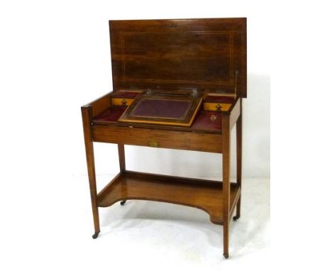 An Edwardian rosewood ladies writing desk, the boxwood strung lid opens to reveal a fitted interior comprising tooled dark re