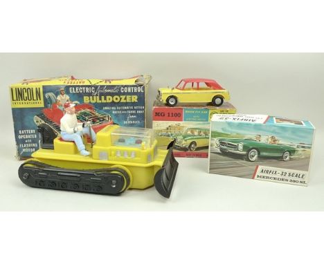 A Lincoln International Automatic Control Bulldozer, battery operated plastic model in yellow, a MG1100 Quick Fit Car with el