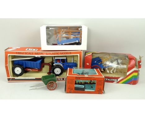 A Britains Tumbrel Cart, 9499, Ford Tractor and Rear Dump, 9630, Cultivator, 9536, all boxed, a further tumbrel cart, and a c