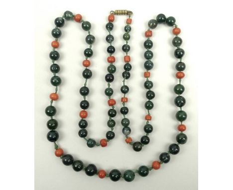 An early 20th century vintage dark green jade and coral bead necklace, 95cm.