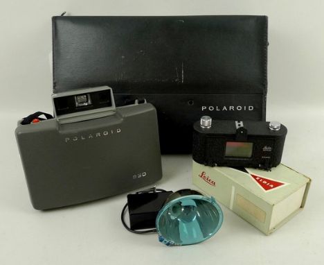 A Leitz Wetzlar Leica Eldia-Printer, with original box and instruction manual, together with a Polaroid 330 camera with case 