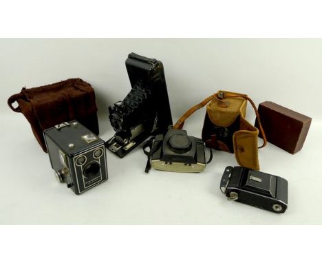 A group of cameras, comprising; a Kodak 620 Popular Brownie, a six 20 Kodak Brownie D, Brownie 44A, a Butchers Panel Carbine 