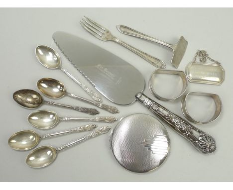 A set of six silver apostle coffee spoons, Birmingham 1921, baby's pusher and a fork, two napkin rings, silver label engraved