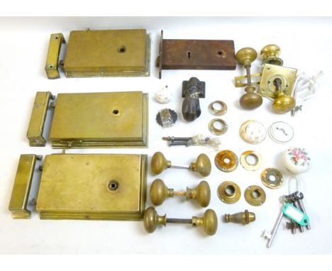 A group of three large Georgian brass door locks and two pairs of handles, together with various brass and one ceramic door k