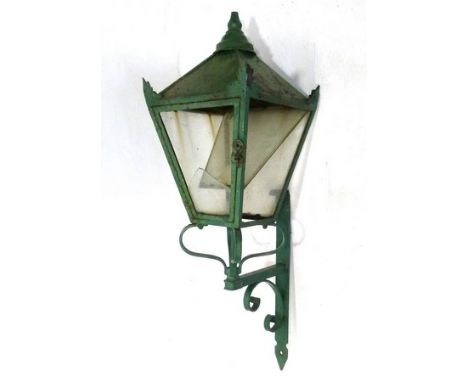A mid 20th century outdoor wall lantern with wrought iron frame, 32 by 32 by 111cm high.