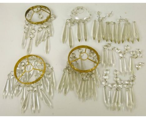 Two cut glass ceiling light shades with clear drops on embossed brass circular hangers, one 10 and two 12cm diameter, and a g
