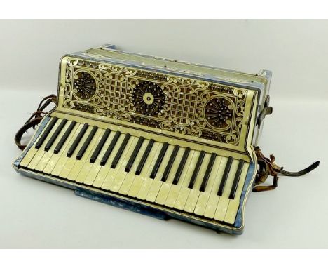 A Soprani piano accordion with blue mother of pearl style finish, one hundred and twenty buttons, twenty four keys, cased. 