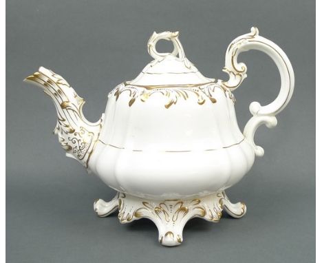 A Coalport porcelain part tea service, circa 1840, with gilt decorated foliate decoration, comprising teapot, slop bowl, pair