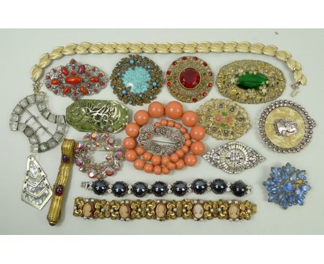 A quantity of antique and vintage costume jewellery including beads, bangles, brooches and clips. 