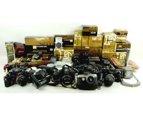 A quantity of cameras and Olympus lenses and accessories including an OM system Auto Bellows Olympus, Teleconverter 2X-A, OM1