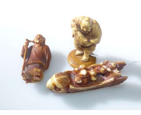 Japanese ivory netsuke, carved as a sage, Meiji period; another carved as a Daoist and another modelled as parrot-form boat (