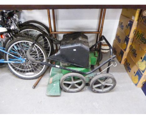 A PETROL DRIVEN ROTARY LAWN MOWER 