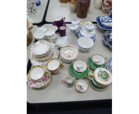 LAWLEYS, REGENT ST. LONDON, A CHINA TEA FOR TWO TEA SERVICE FOR 8 PIECES, FLORAL DECORATED WITH APPLE GREEN AND GILT BORDERS;