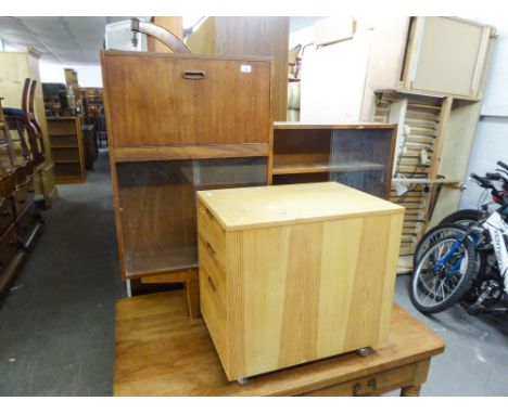 A TEAK STEP TOP BOOKCASE WITH GLASS SLIDING DOORS AND A PINE THREE DRAWER FILING CABINET (2) 