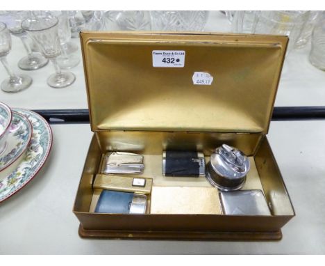 SIX CIGARETTE LIGHTERS, A SILVER VESTA CASE, ALL IN A TIN