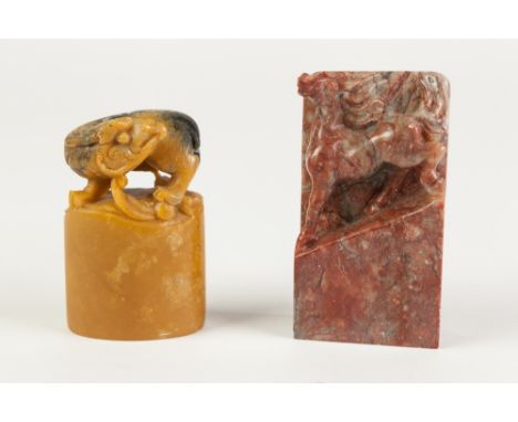 A CHINESE SOAPSTONE SQUARE SEAL, carved with a chilong, 2 1/2" (6.5cm) high, AND ANOTHER  of rectangular section of pinkish g