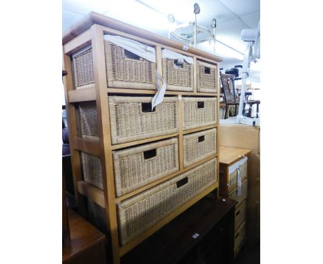 A LIGHT WOOD UNIT WITH EIGHT VARIOUS SIZE FITTED WICKER DRAWERS AND A SIMILAR SMALLER UNIT WITH FOUR WICKER DRAWERS (2) 