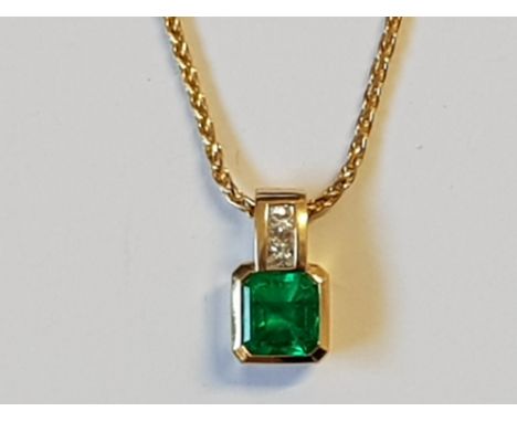 AN 18CT YELLOW GOLD DIAMOND AND OCTAGON STEP CUT COLUMBIAN EMERALD PENDANT THE EMERALD BEING NATURAL AND UNTREATED 1.8CT GRAD