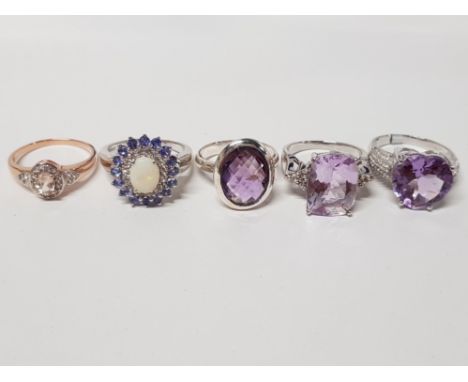 FIVE SILVER RINGS OF VARIOUS DESIGNS THREE WITH PURPLE STONES ALL STAMPED 925 SIZES R TO T+ 31.3G GROSS