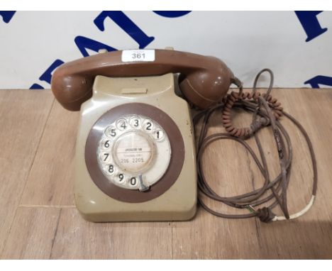 A VINTAGE TELEPHONE IN BROWN AND GREEN
