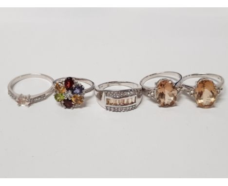 FIVE SILVER RINGS OF VARIOUS DESIGNS FOUR WITH LIGHT BROWN STONES ALL STAMPED 925 SIZES R TO U 21.3G GROSS