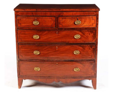 A George III mahogany bowfront chest, with line inlaid frieze above two short and three long graduated drawers, all with ebon